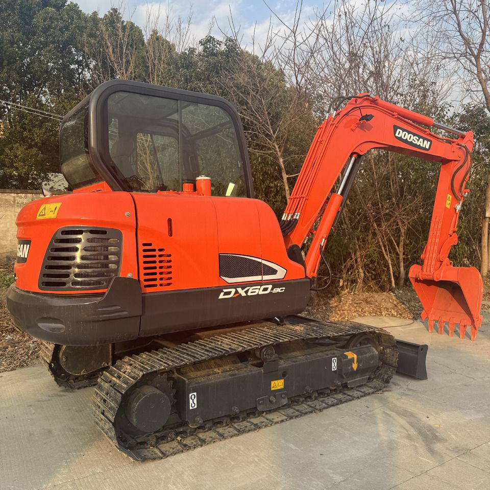 2023 Doosan DX60-9C mini excavator, rear three-quarter view