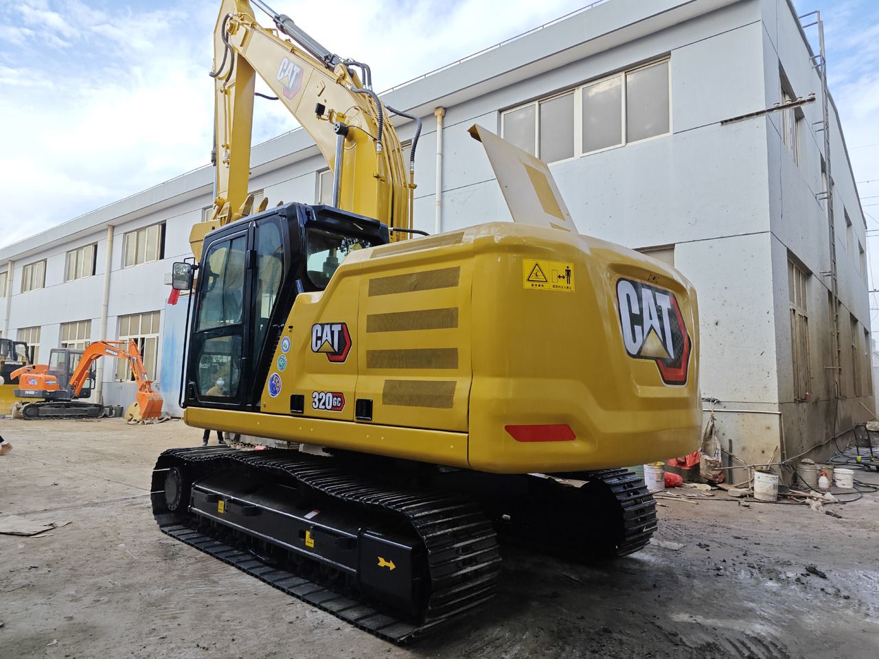 Caterpillar 320GC crawler excavator, rear three-quarter view