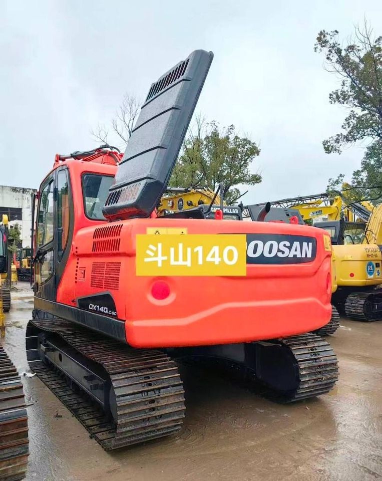 2023 Doosan DX140LC-5C crawler excavator, rear three-quarter view 2023 Doosan DX140LC-5C crawler excavator, rear three-quarter view