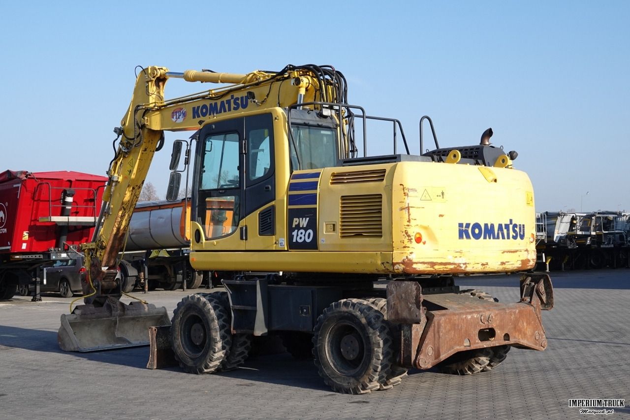 2017 Komatsu PW180-10 wheel excavator, rear three-quarter view 2017 Komatsu PW180-10 wheel excavator, rear three-quarter view