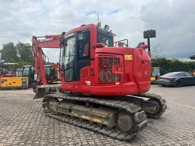 2019 Komatsu 138US-11 crawler excavator, rear three-quarter view 2019 Komatsu 138US-11 crawler excavator, rear three-quarter view