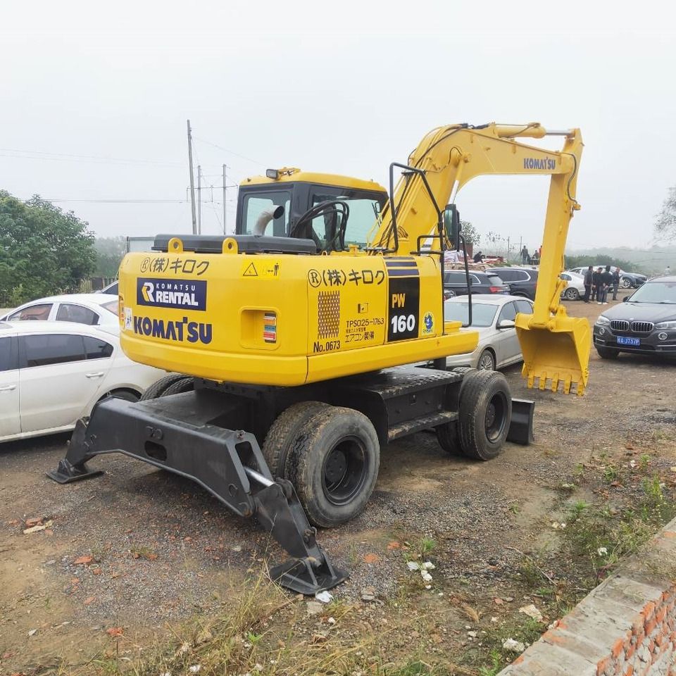 2023 Komatsu PW160W-7 wheel excavator, rear three-quarter view 2023 Komatsu PW160W-7 wheel excavator, rear three-quarter view