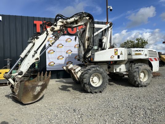 2005 Mecalac 12MXT wheel excavator, side view 2005 Mecalac 12MXT wheel excavator, side view