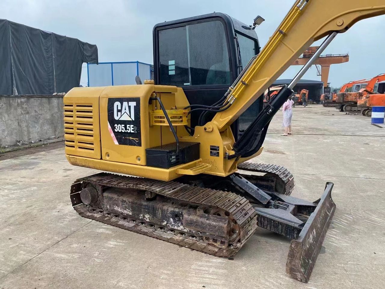 2022 Caterpillar 305.5E2 excavator, side view