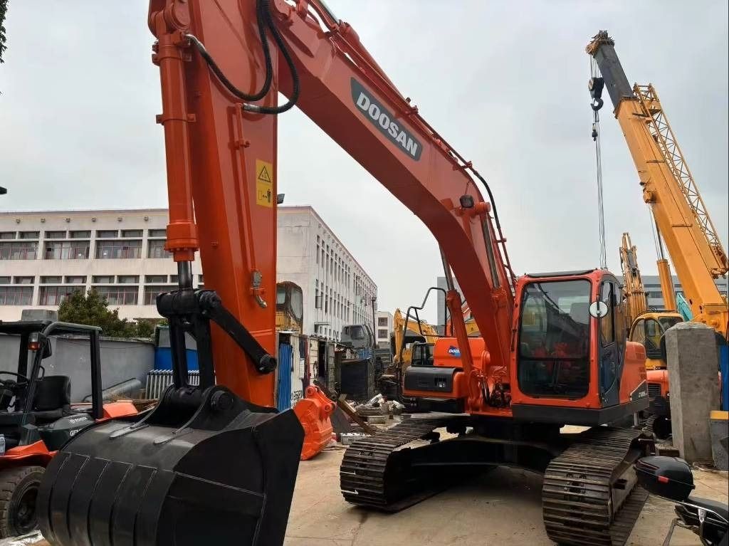 2022 Doosan DX225LC crawler excavator, front three-quarter view