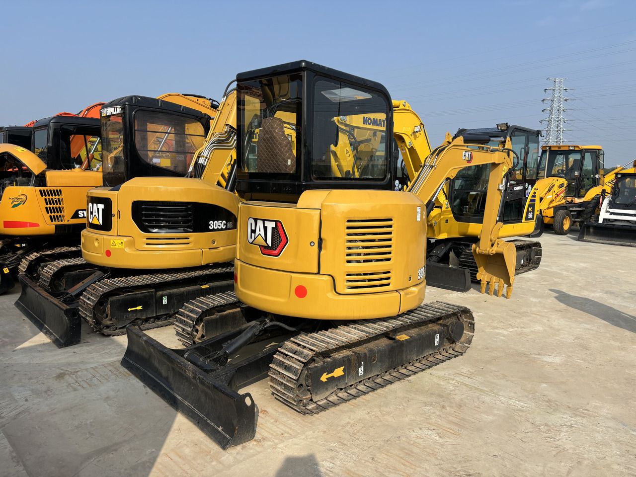 2023 Caterpillar 303.5E mini excavator, rear three-quarter view