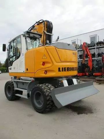 2023 Liebherr A 913 Compact wheel excavator, rear three-quarter view 2023 Liebherr A 913 Compact wheel excavator, rear three-quarter view