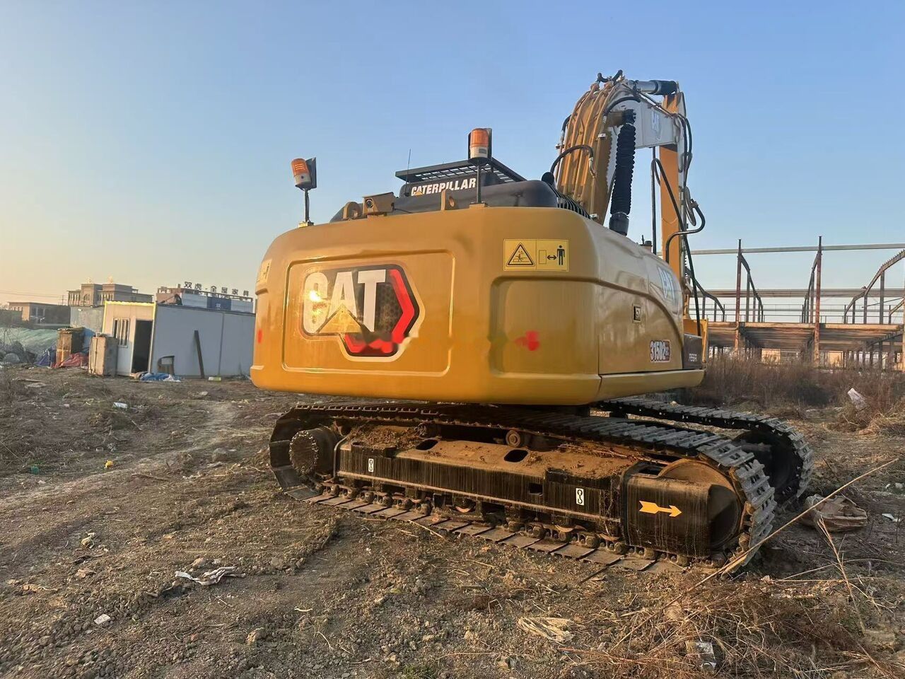 Caterpillar 315D2 crawler excavator, rear three-quarter view