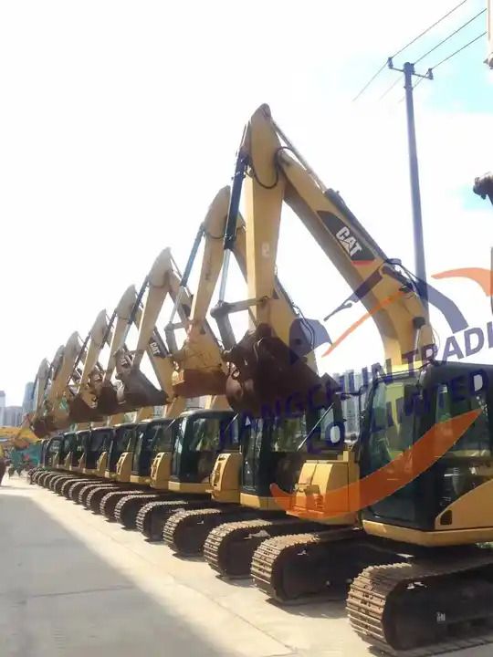 2016 Caterpillar 306D excavator, side profile view of a row of machines 2016 Caterpillar 306D excavator, side profile view of a row of machines