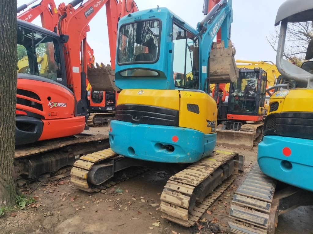 2023 Kubota KX135-3S mini excavator, rear three-quarter view 2023 Kubota KX135-3S mini excavator, rear three-quarter view