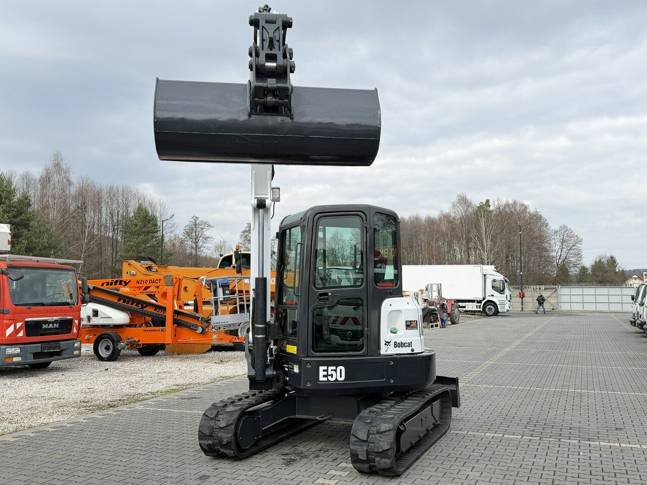 2013 Bobcat E50 mini excavator, front view with raised bucket 2013 Bobcat E50 mini excavator, front view with raised bucket