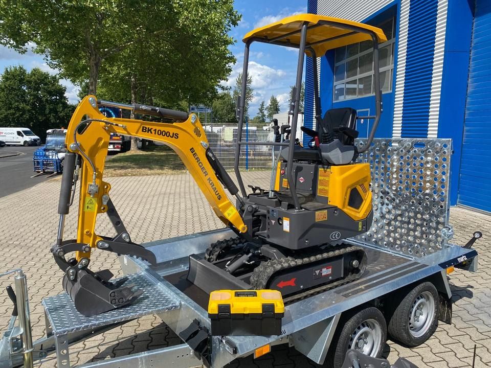 Berger Kraus BK1000JS mini excavator on a trailer, side view Berger Kraus BK1000JS mini excavator on a trailer, side view