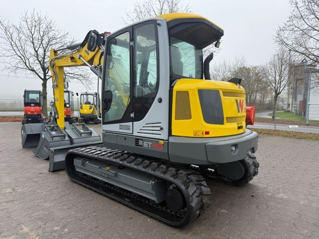 2025 Wacker Neuson ET90 mini excavator, rear three-quarter view 2025 Wacker Neuson ET90 mini excavator, rear three-quarter view