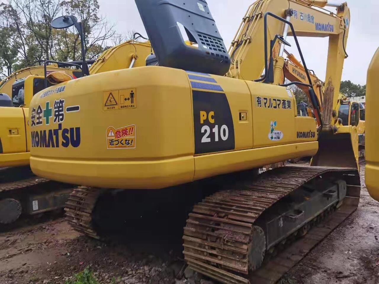 2011 Komatsu PC210-8 crawler excavator rear three-quarter view 2011 Komatsu PC210-8 crawler excavator rear three-quarter view