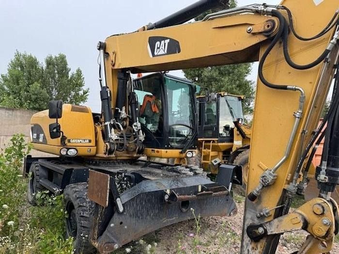2012 Caterpillar M322D wheel excavator, rear three-quarter view