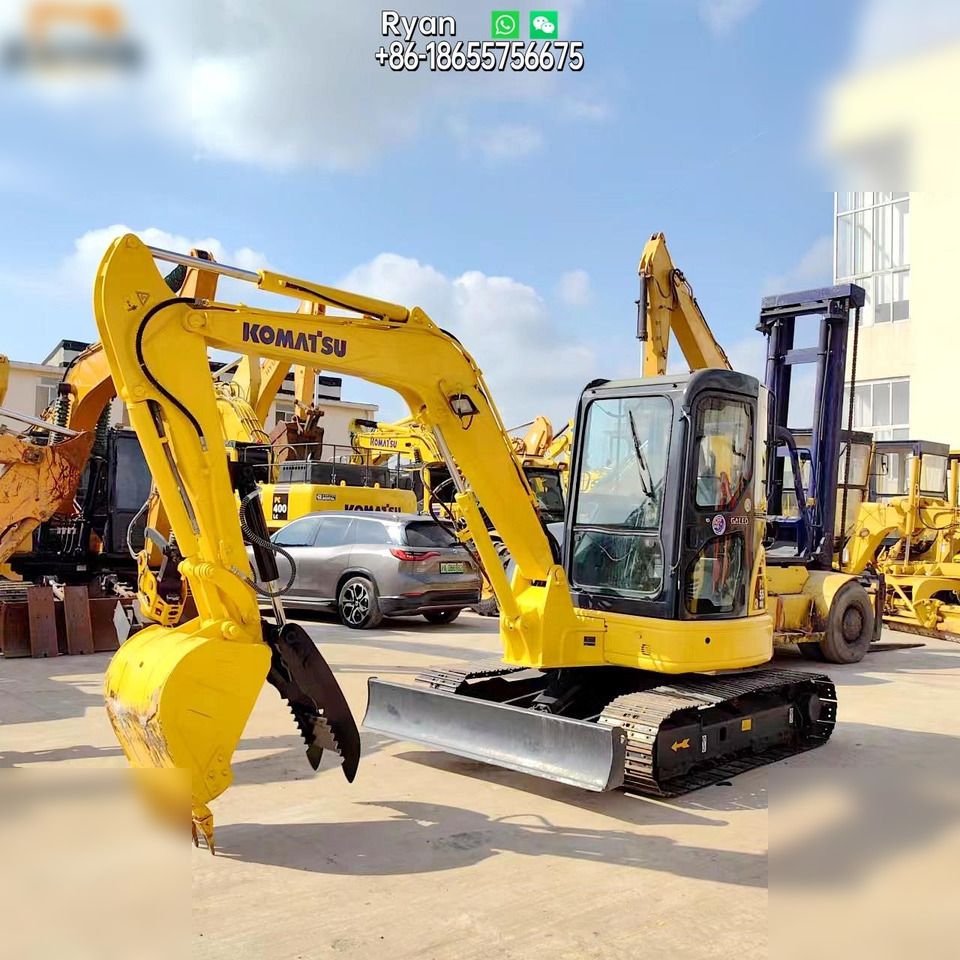 Komatsu PC55MR-2 mini excavator, front three-quarter view Komatsu PC55MR-2 mini excavator, front three-quarter view