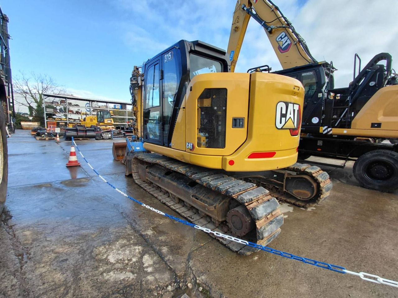 2023 Caterpillar 315 crawler excavator, rear three-quarter view