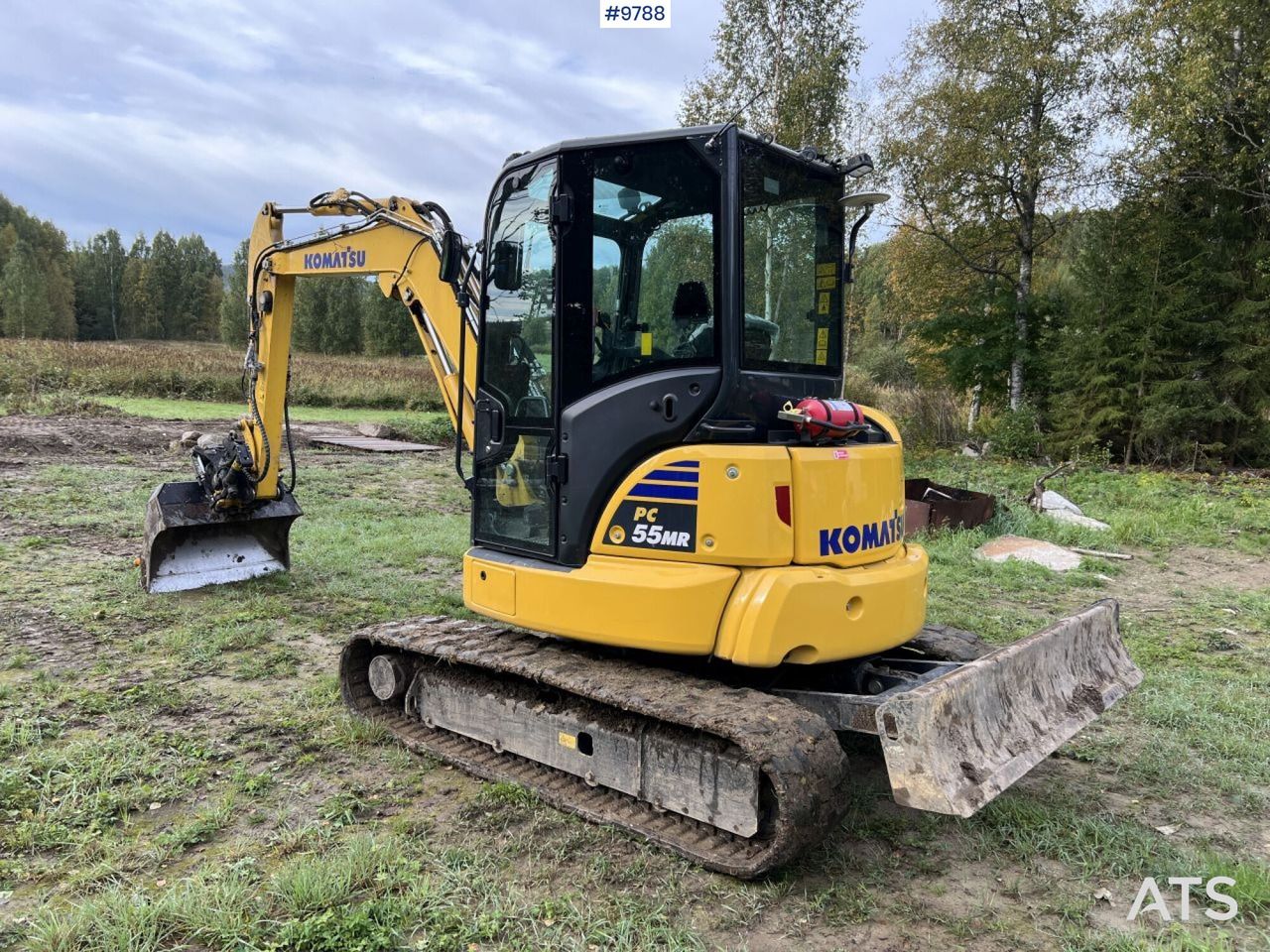 2021 Komatsu PC55MR-5 mini excavator, rear three-quarter view 2021 Komatsu PC55MR-5 mini excavator, rear three-quarter view