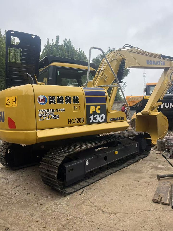 2019 Komatsu PC130 crawler excavator, rear three-quarter view 2019 Komatsu PC130 crawler excavator, rear three-quarter view