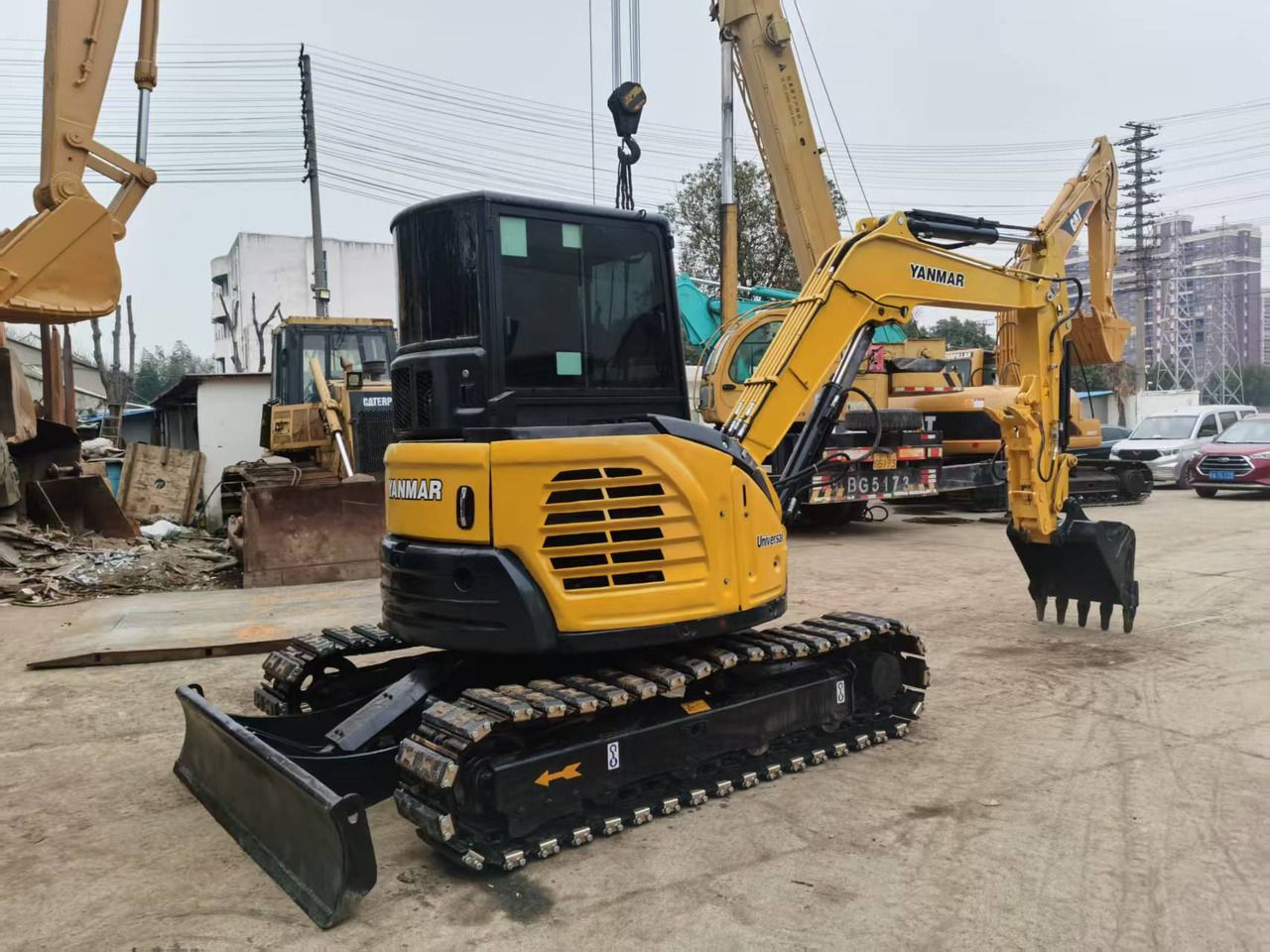 2022 Yanmar VIO55-6B mini excavator, rear three-quarter view