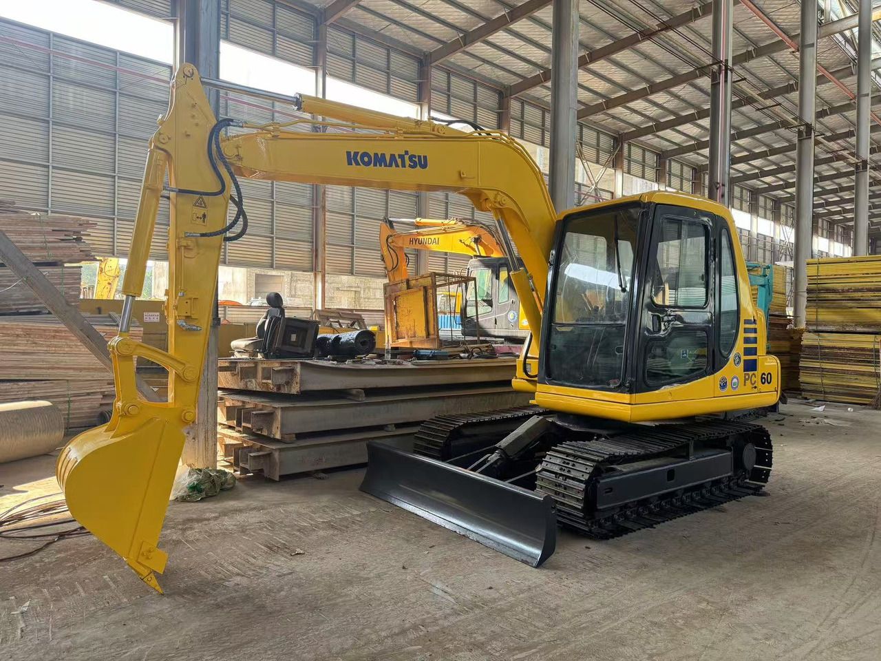 2018 Komatsu PC60-7 mini excavator, front three-quarter view 2018 Komatsu PC60-7 mini excavator, front three-quarter view
