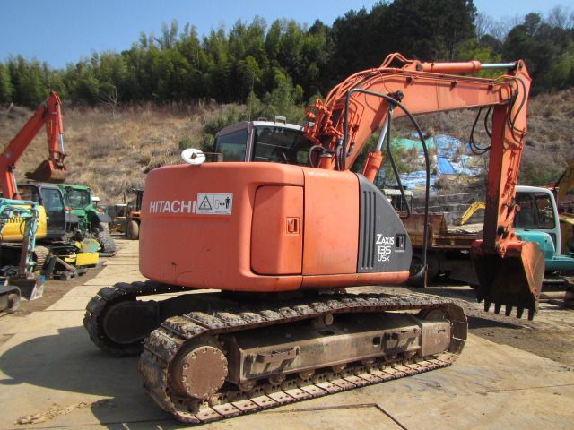 2004 Hitachi ZX135USK crawler excavator, rear three-quarter view 2004 Hitachi ZX135USK crawler excavator, rear three-quarter view