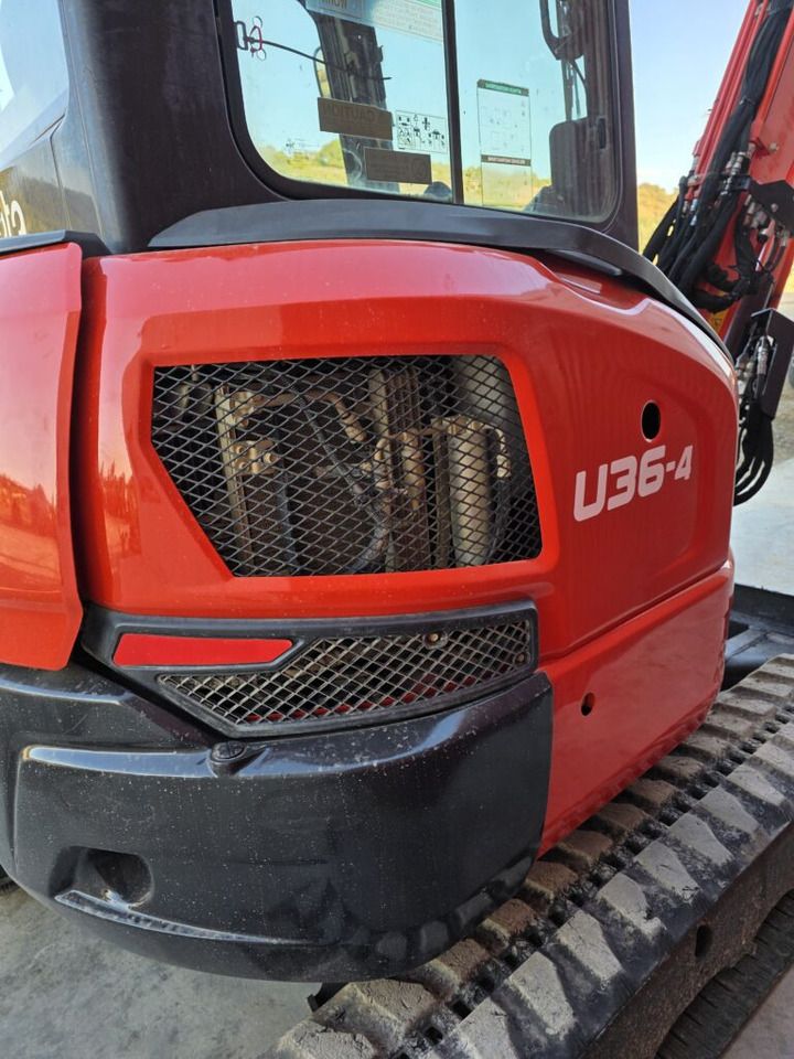 2021 Kubota U36-4 mini excavator side view of the engine compartment 2021 Kubota U36-4 mini excavator side view of the engine compartment