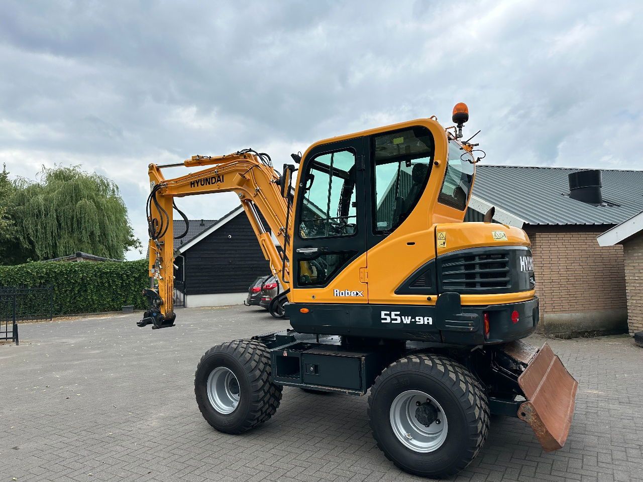 2018 Hyundai 55W-9A wheel excavator, rear three-quarter view 2018 Hyundai 55W-9A wheel excavator, rear three-quarter view