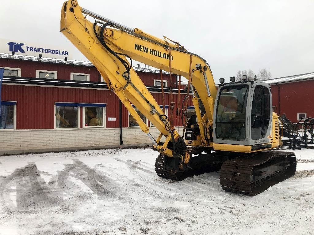 New Holland E135SR crawler excavator, side view New Holland E135SR crawler excavator, side view