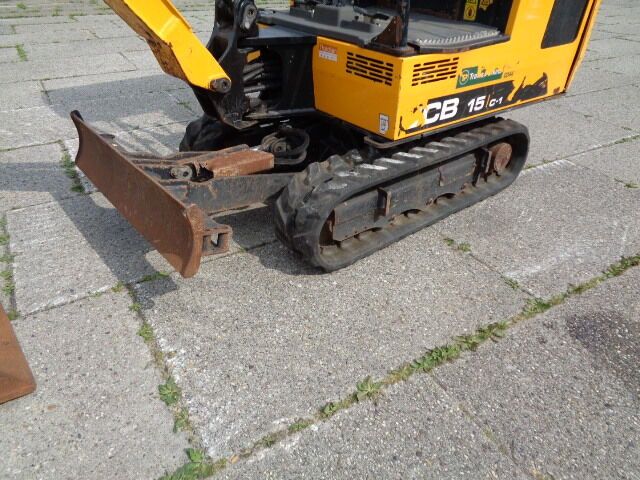 2018 JCB 15C-1 mini excavator, front-side view of tracks and blade