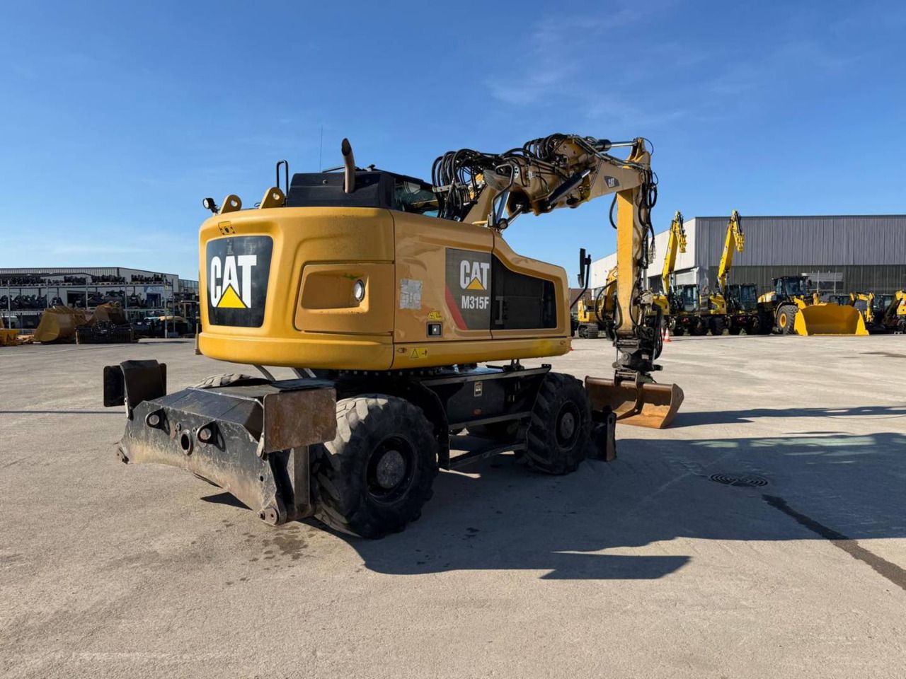 2019 Caterpillar M315F wheel excavator, rear three-quarter view