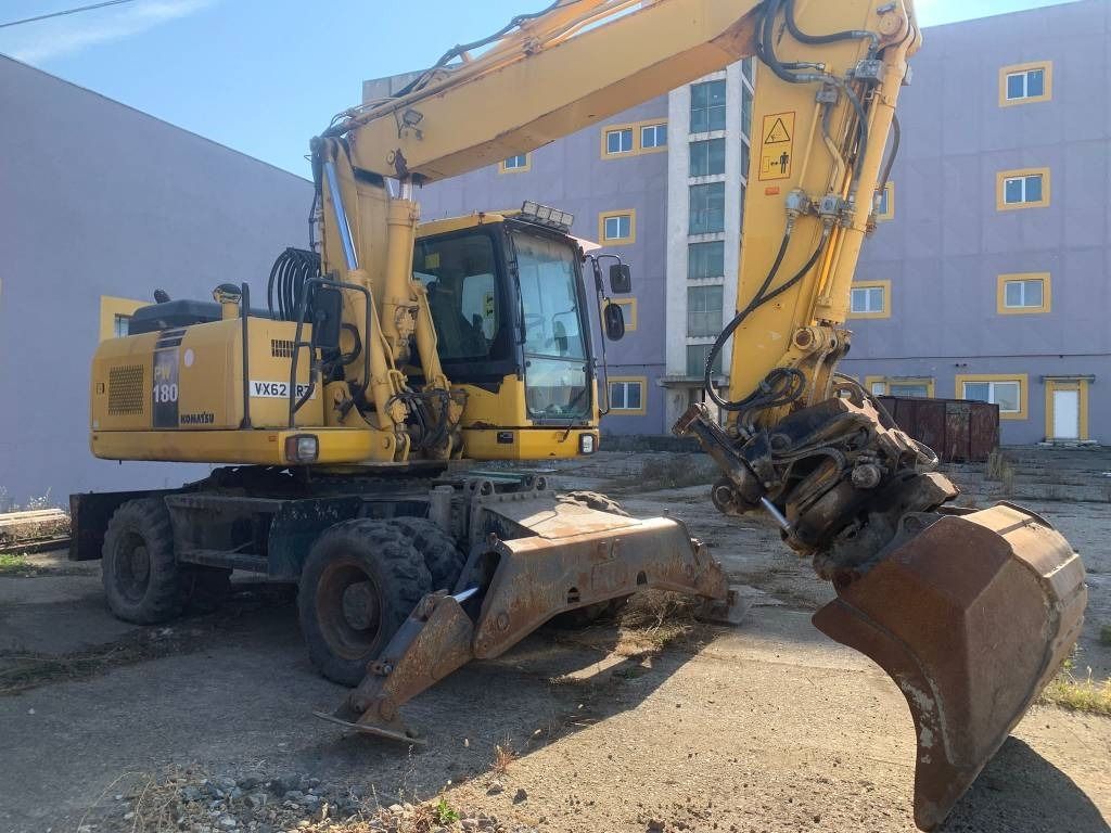 2012 Komatsu PW180-E0 wheel excavator, front three-quarter view 2012 Komatsu PW180-E0 wheel excavator, front three-quarter view