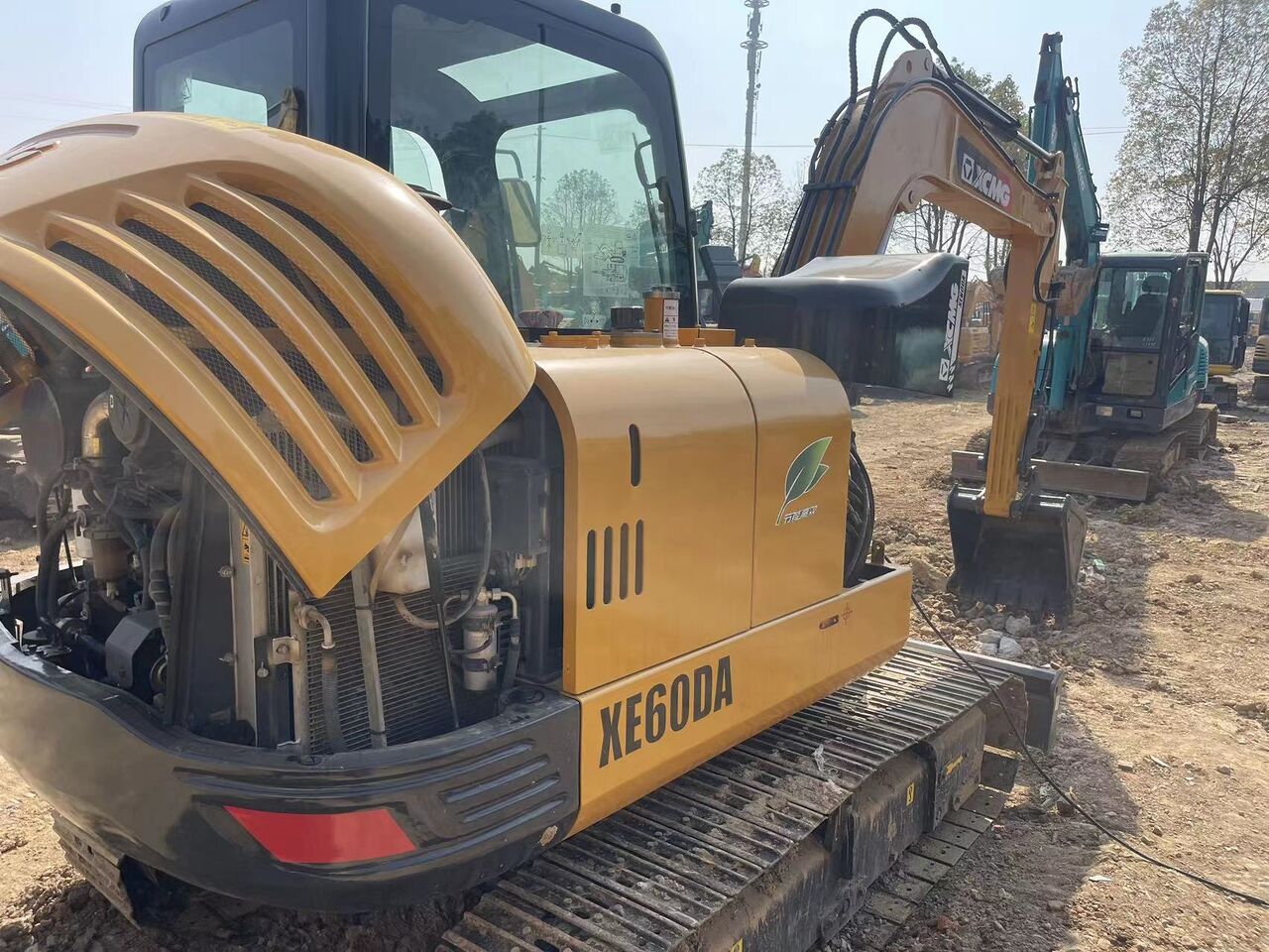 2023 XCMG XE60DA mini excavator, rear three-quarter view with engine cover open
