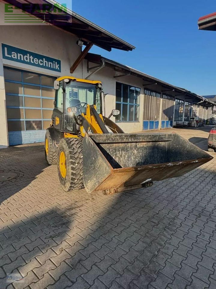 2011 JCB 409 wheel loader, front three-quarter view