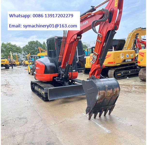 2023 Kubota KX057-4 mini excavator, rear three-quarter view 2023 Kubota KX057-4 mini excavator, rear three-quarter view