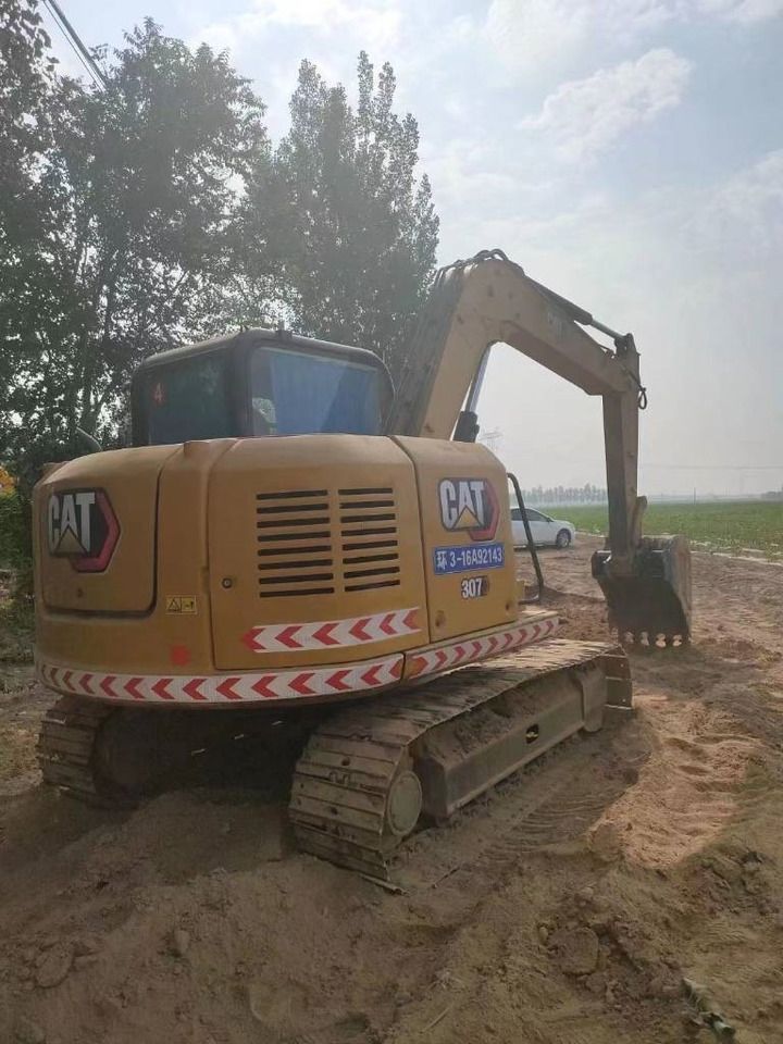 2023 Caterpillar 307E2 mini excavator rear three-quarter view 2023 Caterpillar 307E2 mini excavator rear three-quarter view
