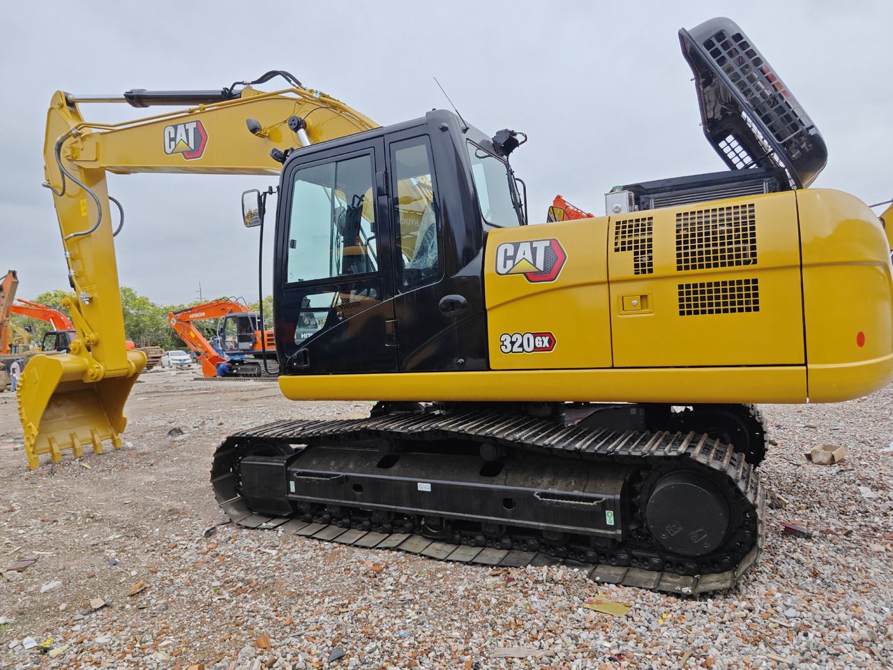 Caterpillar 320GX crawler excavator, side view Caterpillar 320GX crawler excavator, side view