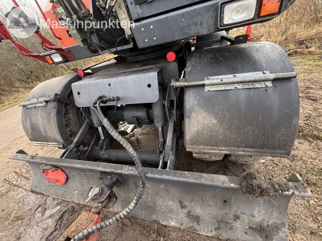 2014 Atlas 160W wheel excavator rear view with dozer blade