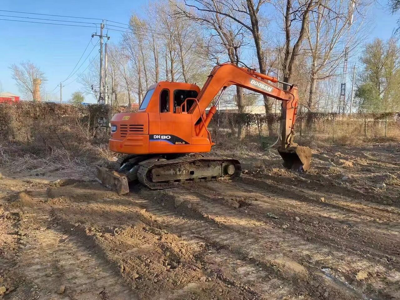 2023 Doosan DH80G mini excavator, rear three-quarter view 2023 Doosan DH80G mini excavator, rear three-quarter view
