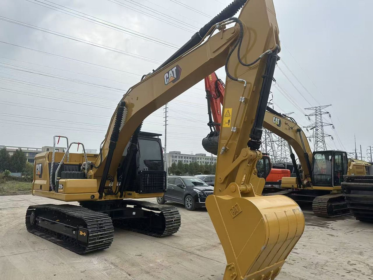 2023 Caterpillar 320GC crawler excavator, rear three-quarter view 2023 Caterpillar 320GC crawler excavator, rear three-quarter view
