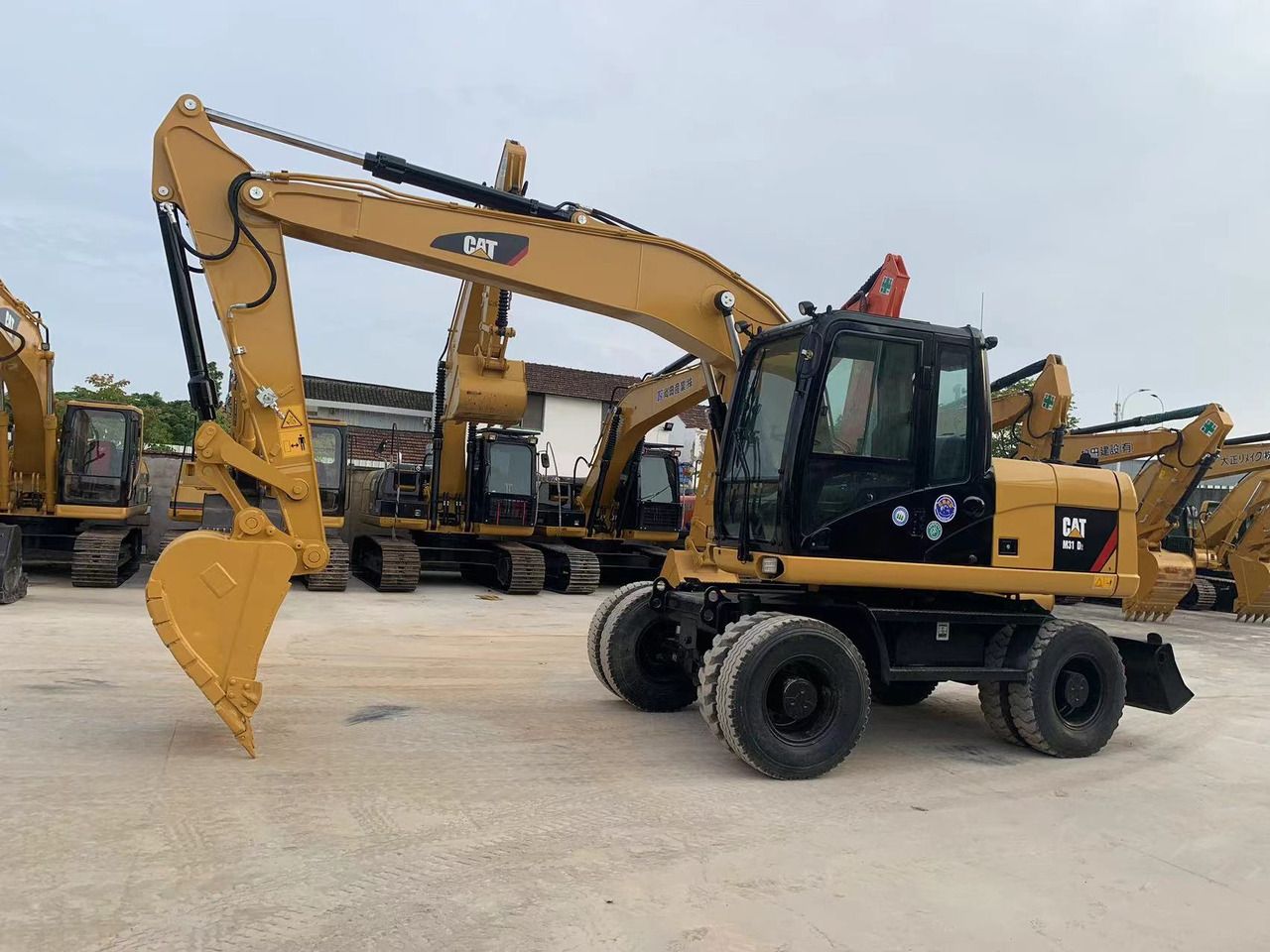 2021 Caterpillar M315D wheel excavator, side view 2021 Caterpillar M315D wheel excavator, side view