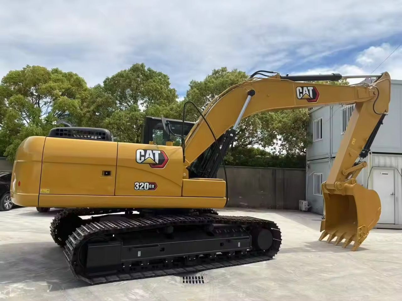 Caterpillar 320GX crawler excavator, side view Caterpillar 320GX crawler excavator, side view