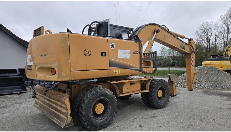 2008 CASE WX210 wheel excavator, rear three-quarter view 2008 CASE WX210 wheel excavator, rear three-quarter view