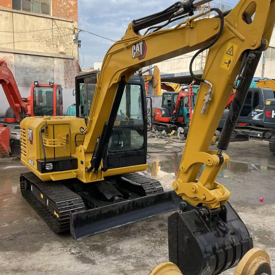 2023 Caterpillar 305.5E2 mini excavator, front three-quarter view