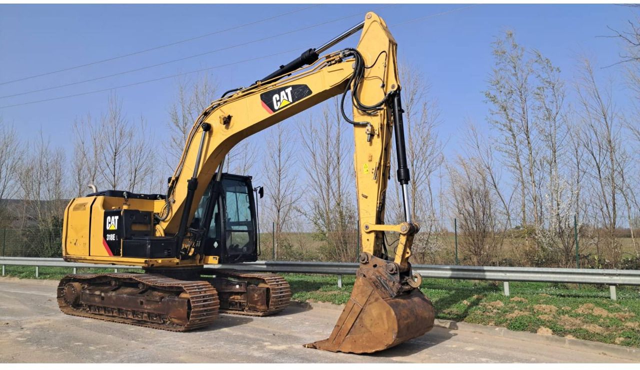2014 Caterpillar 318E crawler excavator side view 2014 Caterpillar 318E crawler excavator side view