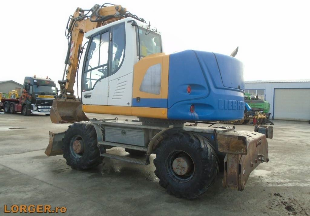 2014 Liebherr A914 COMPACT wheel excavator, rear three-quarter view