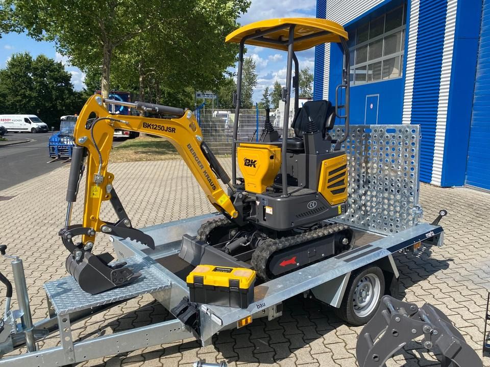 Berger Kraus BK1250JSR mini excavator on a trailer, side view Berger Kraus BK1250JSR mini excavator on a trailer, side view