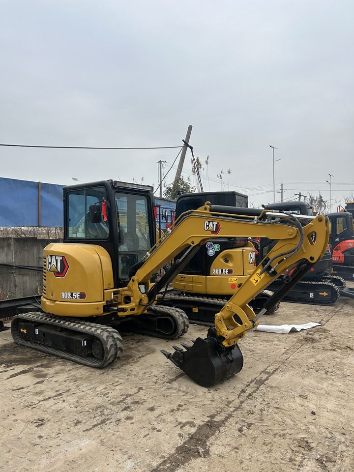 2023 Caterpillar 303.5E mini excavator, front three-quarter view
