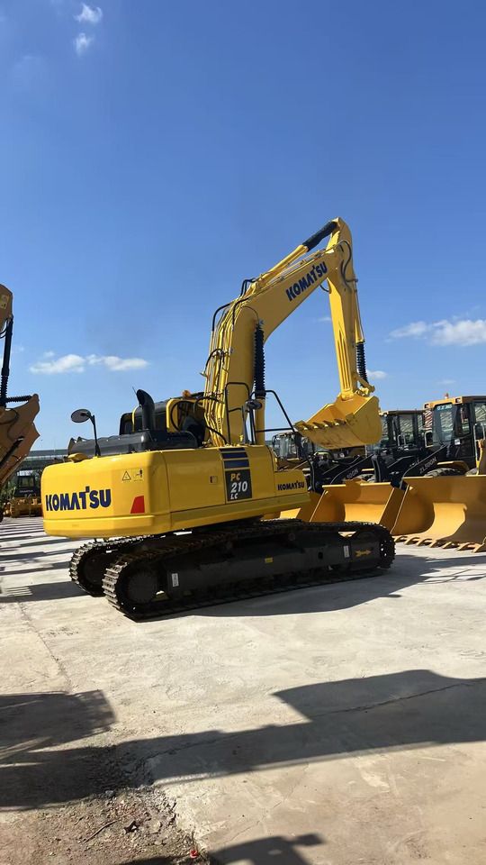 2023 Komatsu PC210LC crawler excavator, rear three-quarter view 2023 Komatsu PC210LC crawler excavator, rear three-quarter view