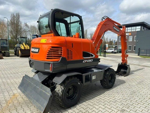 2018 Doosan DX60 wheel excavator, rear three-quarter view 2018 Doosan DX60 wheel excavator, rear three-quarter view